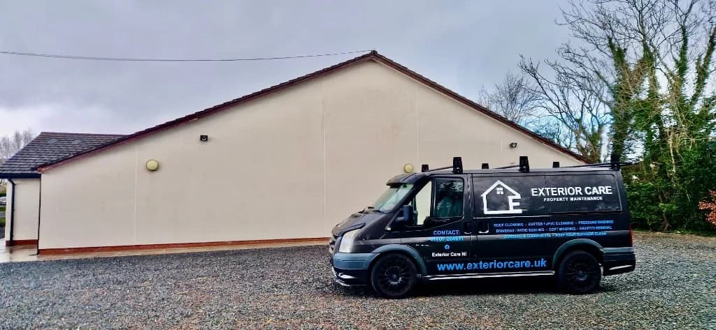 Exterior Care NI van in front of a cleaned residential exterior wall